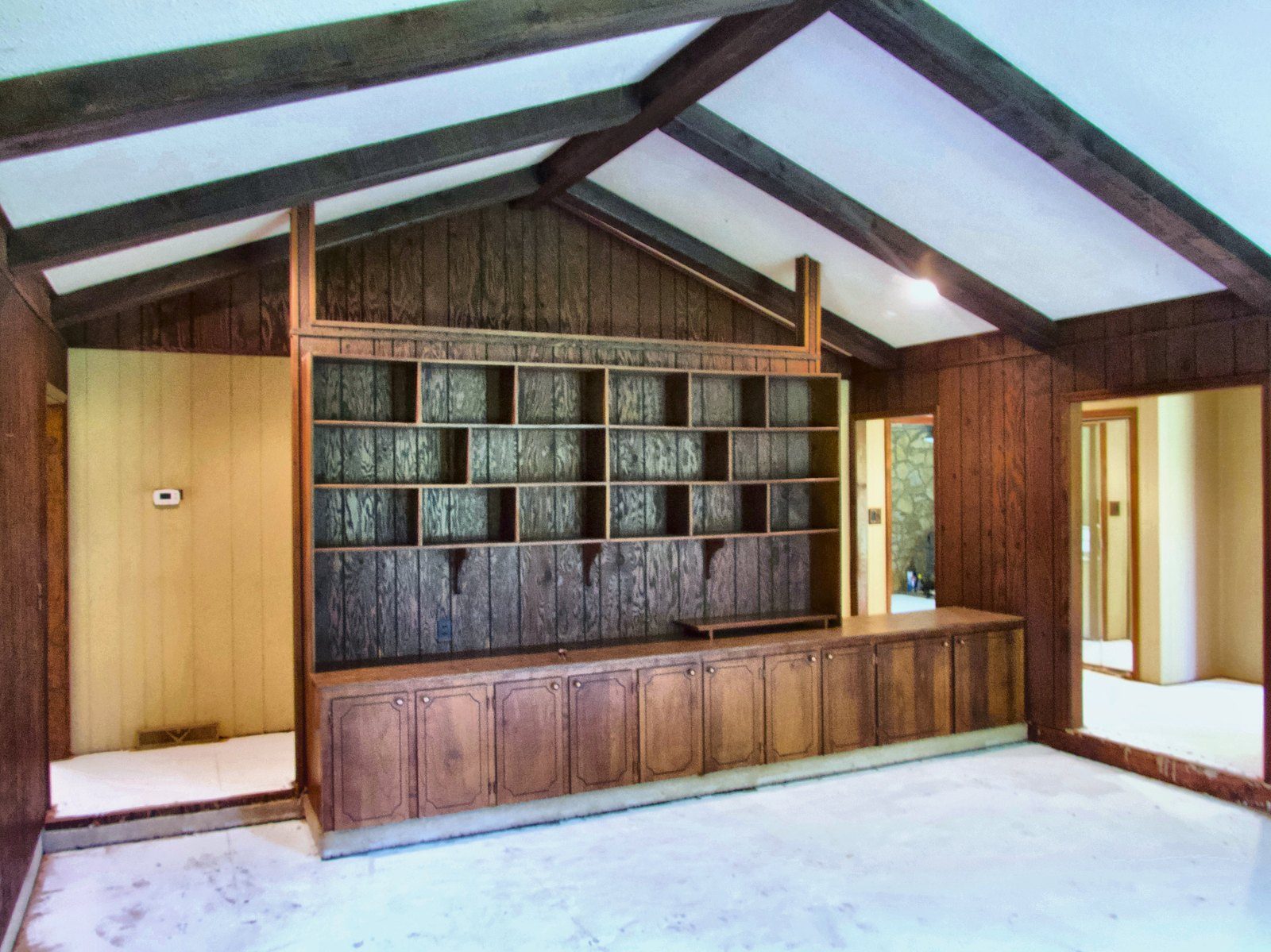 2555 residence — vaulted room with mid-century wood built-ins and exposed beams