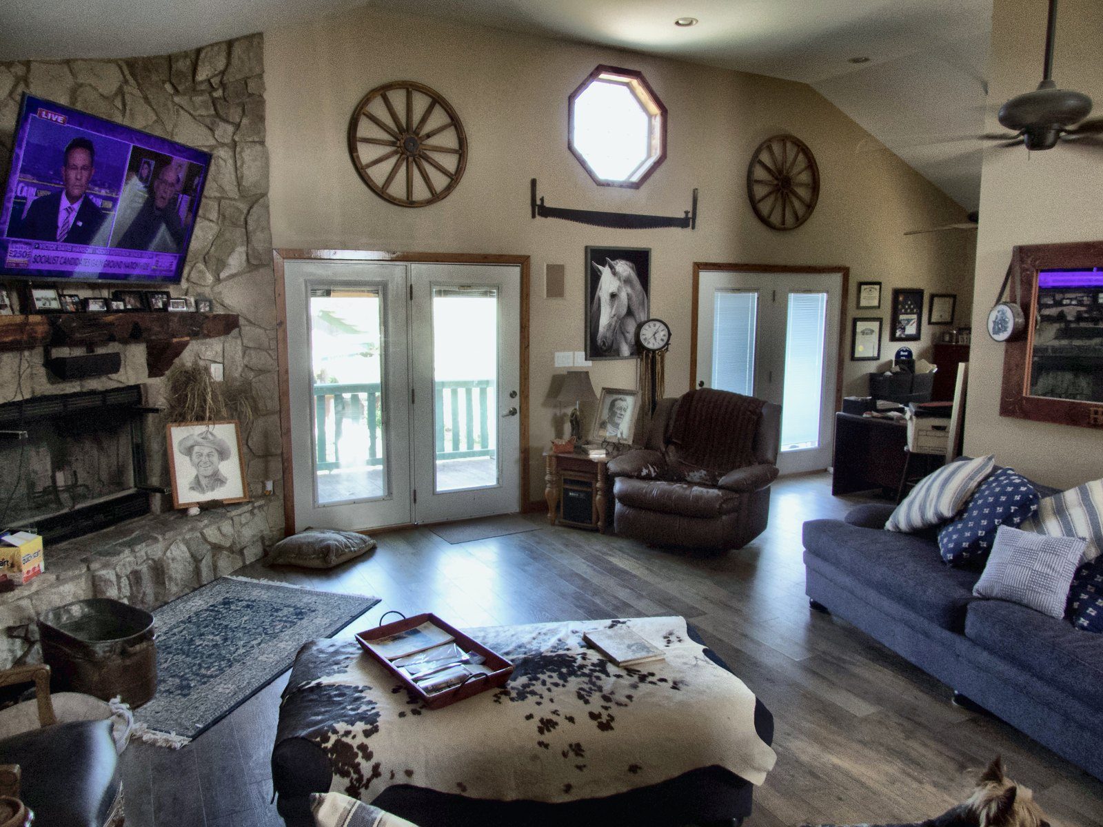 3400 residence — great room with stone fireplace and vaulted ceiling
