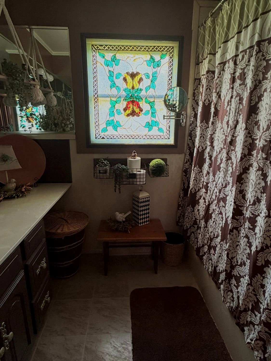3400 residence — bathroom with stained-glass window