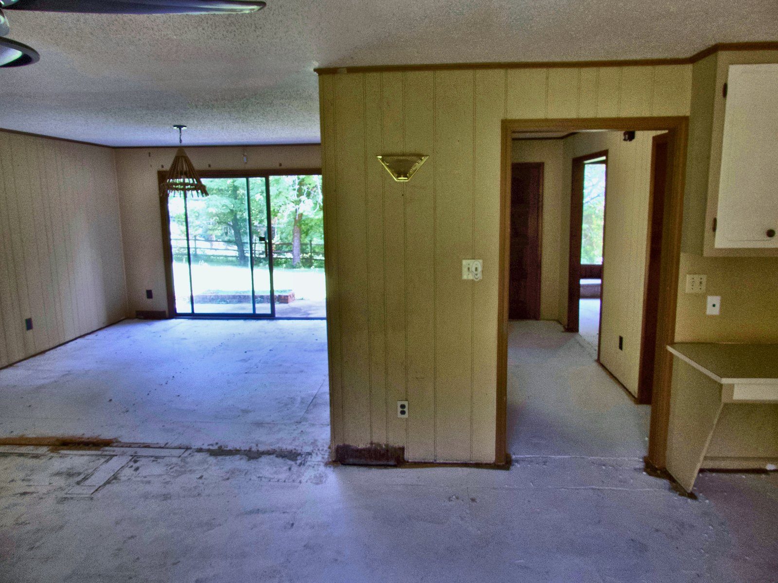 2555 residence — open living and dining with kitchen pass-through