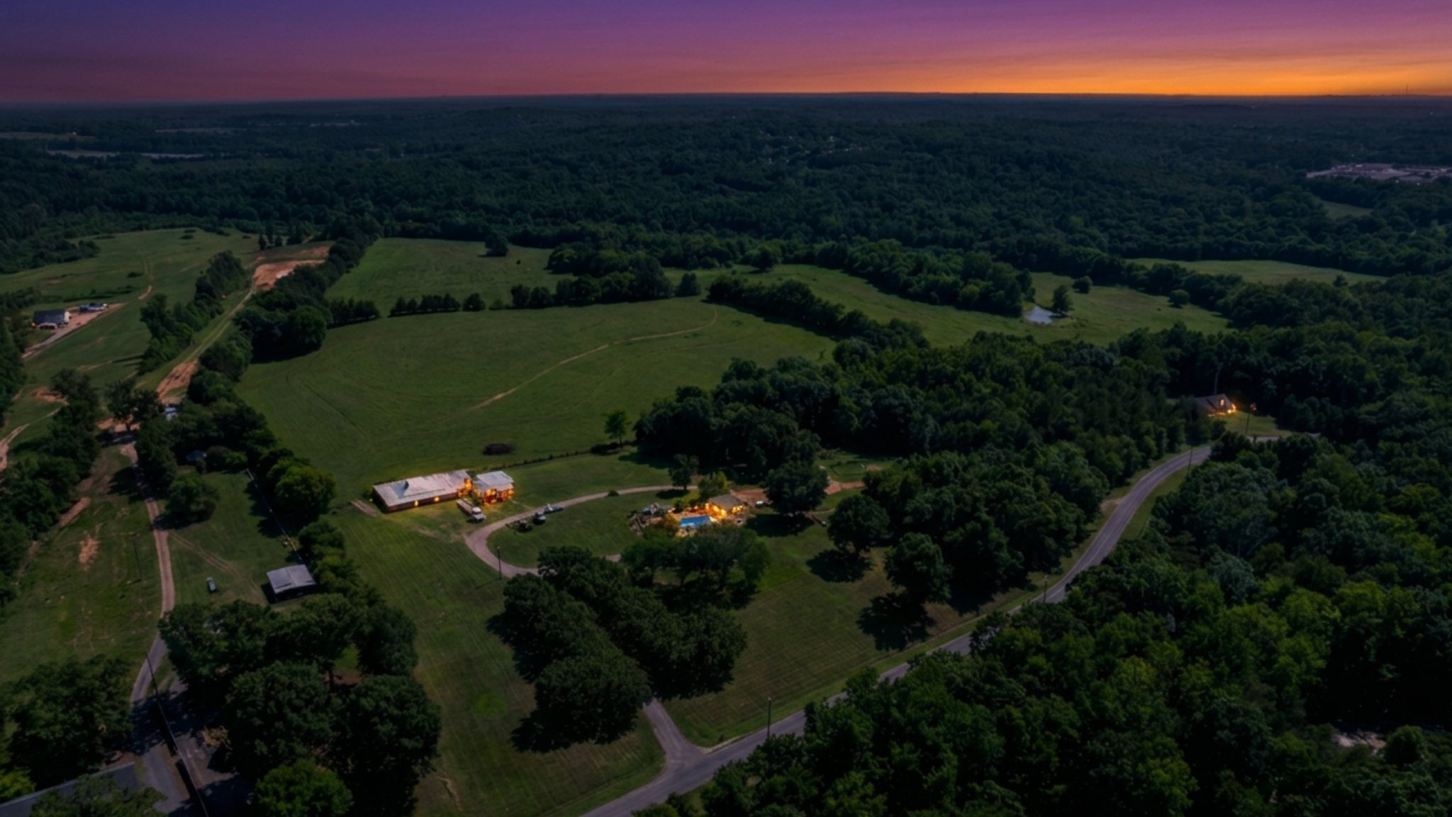 Dark-sky aerial over Biggers Road fields and treeline