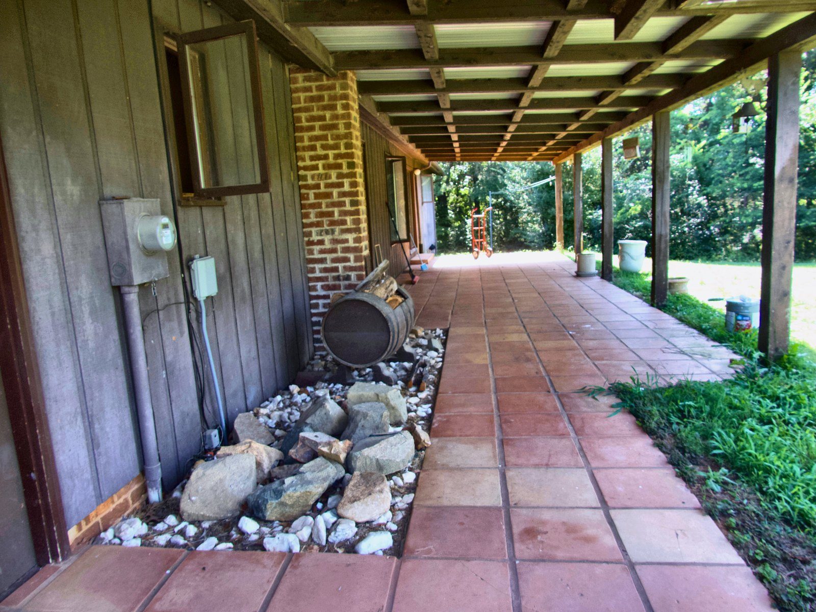 2555 residence — covered breezeway with terracotta tile