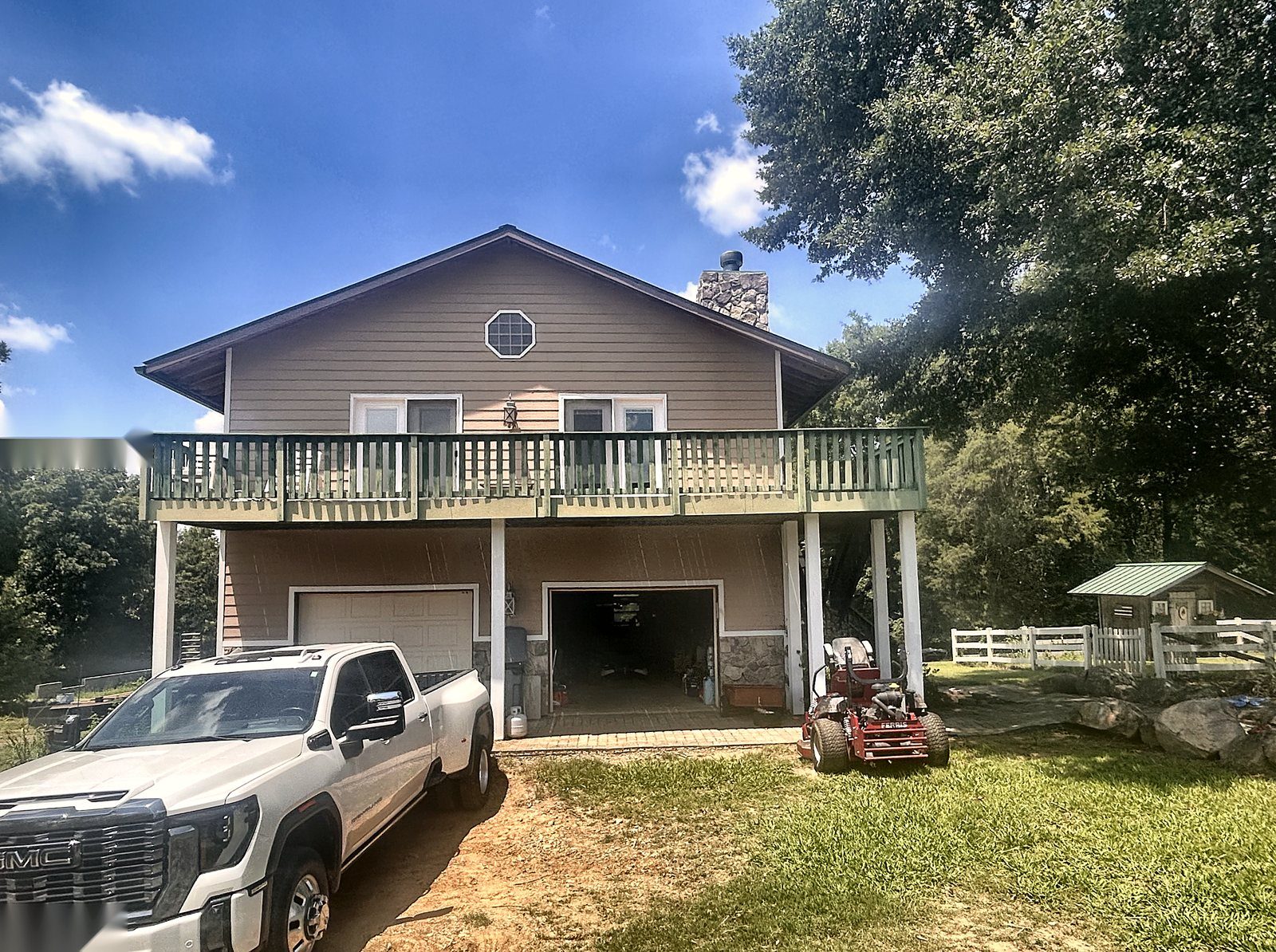 3400 Biggers Road — dwelling front exterior with upper deck and drive-under garage