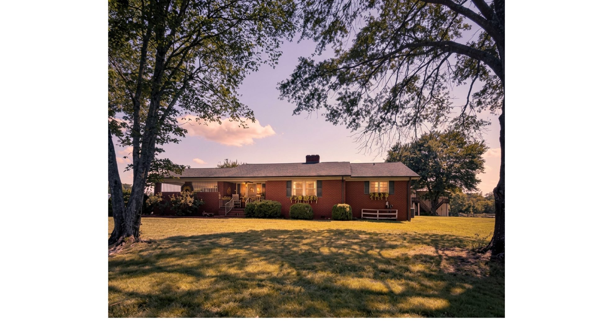 3400 residence — brick ranch home at dusk